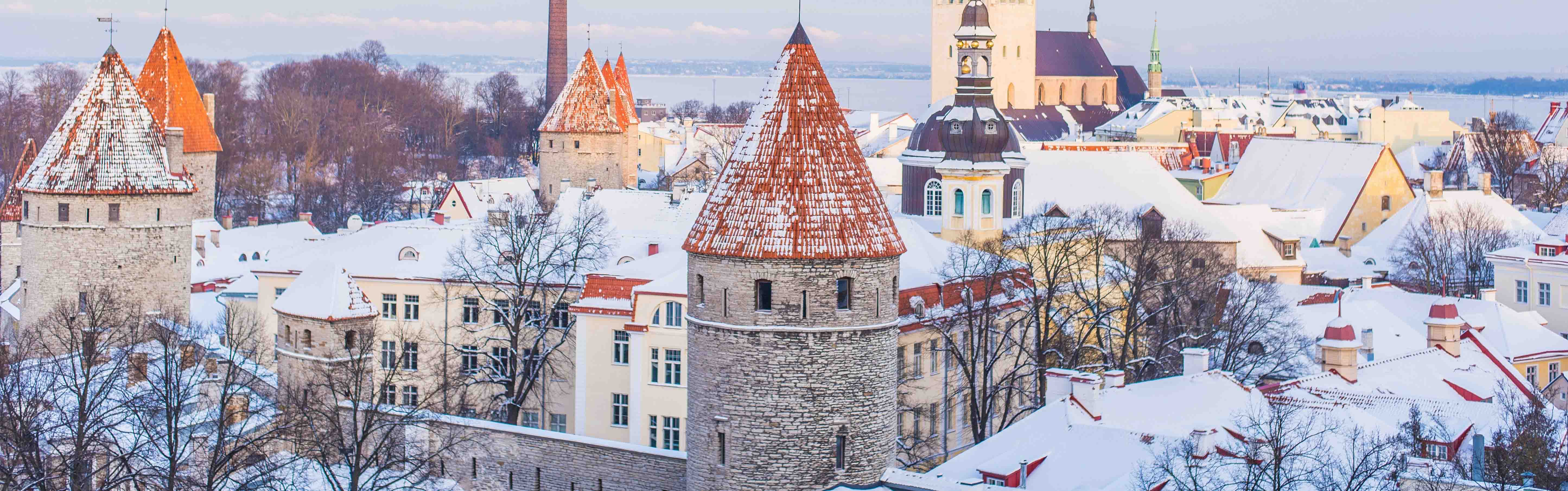 Snowy castle under cloudy skies in Old Town, Tallinn, Estonia